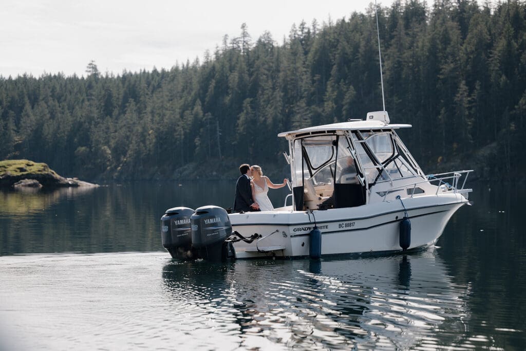 Hayley Zumkeller photography and videography team capture a bride and groom as they set sail for a romantic boat ride on the water following their wedding.