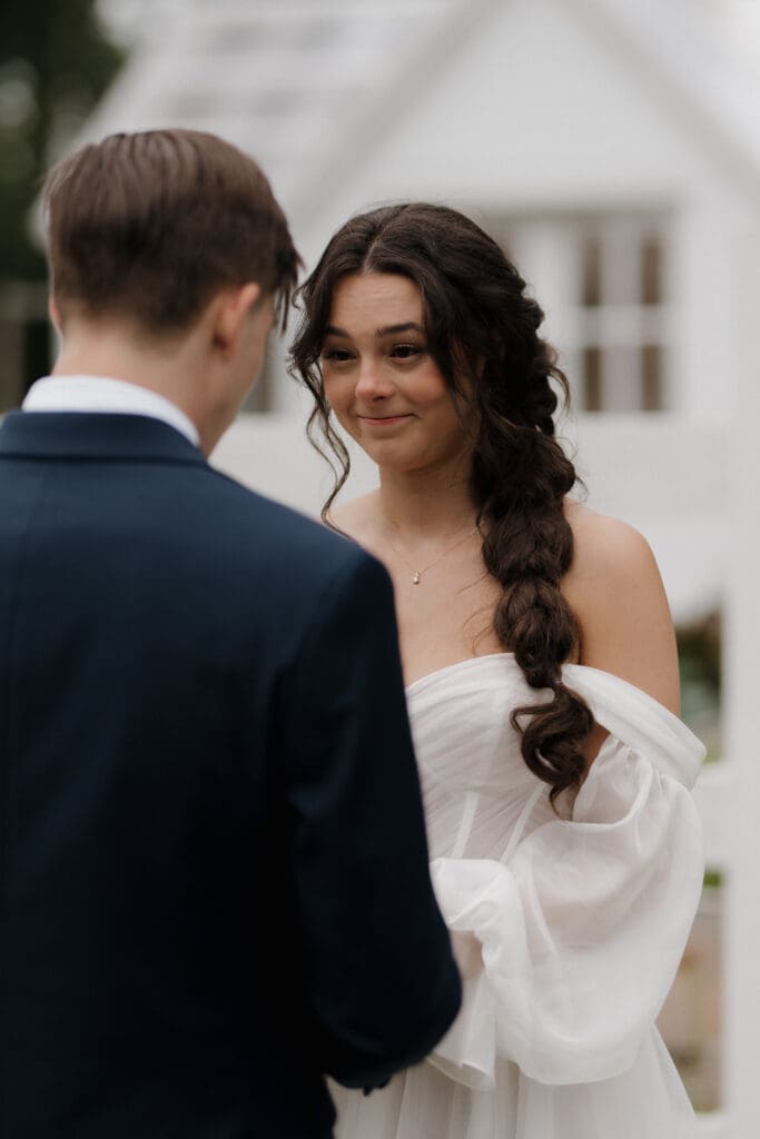 Hayley Zumkeller photography and videography team from Victoria BC capture an emotional moment between a bride and groom during their first look prior to their wedding.