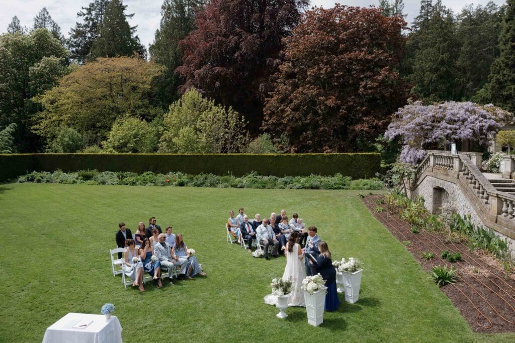 Hatley Castle Wedding in Victoria BC captured by local Wedding Photographer Hayley Zumkeller - Intimate, Elegant, Wedding Ceremony on the grass below the italian gardens