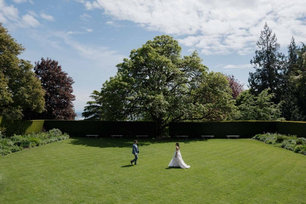 Couple running in the grass at Hatley Caslte - local Victoria BC Wedding Photographer captures wedding photos at Hatley Castle Wedding in BC