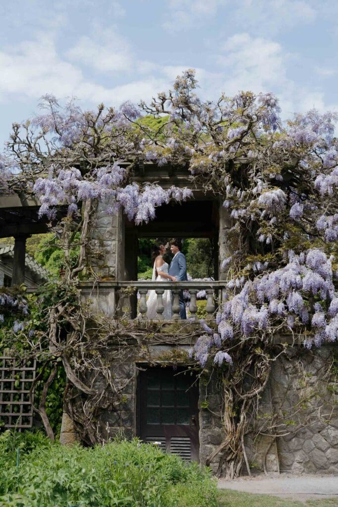 Couple running in the grass at Hatley Caslte - local Victoria BC Wedding Photographer captures wedding photos at Hatley Castle Wedding in BC