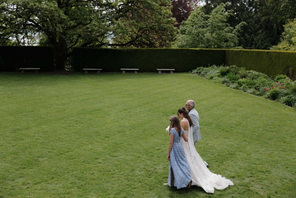 Hatley Castle Wedding in Victoria BC captured by local Wedding Photographer Hayley Zumkeller - Intimate, Elegant, Wedding Ceremony on the grass below the italian gardens