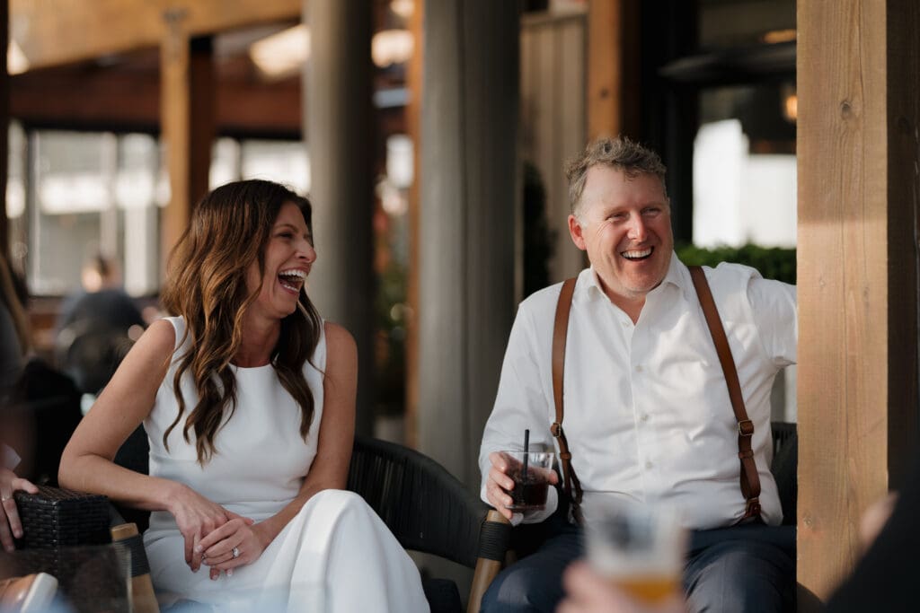 Tofino BC Wedding Photographer and Videographer captures bride and groom after their wedding ceremony at Browns Social House where the family sat by the fire, enjoyed good food, and good music.