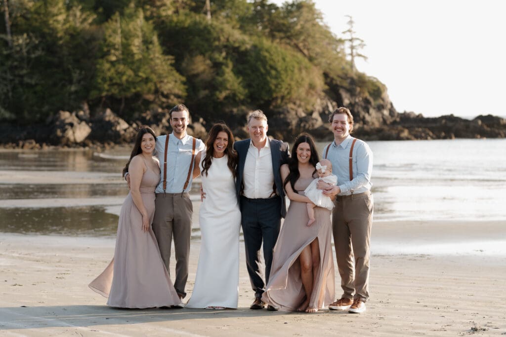 Hayley Zumkeller, wedding photography and videography team from Victoria BC, capture a couple with their children and granddaughter following their elopement ceremony on Chesterman Beach in Tofino BC.