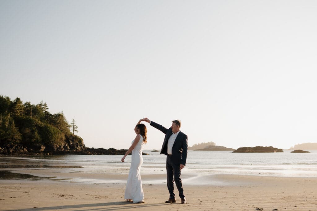 Tofino BC Wedding Photographer and Videographer captures bride and groom, and their family on Chesterman Beach. Sunset Wedding Photogrpahy at Chesterman Beach with the Bride and Groom at Golden Hour in Tofino
