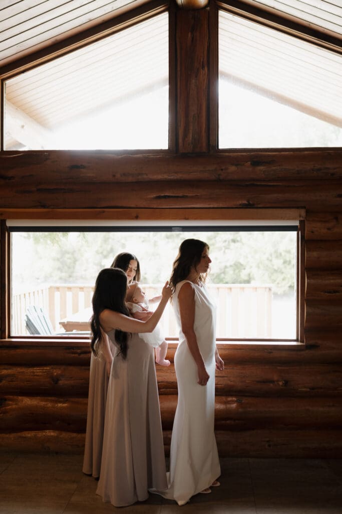 Bride getting ready in Crystal Cove Cabin for her Tofino BC Wedding. Local Tofino BC Wedding Photographer captures moments on both photo and video