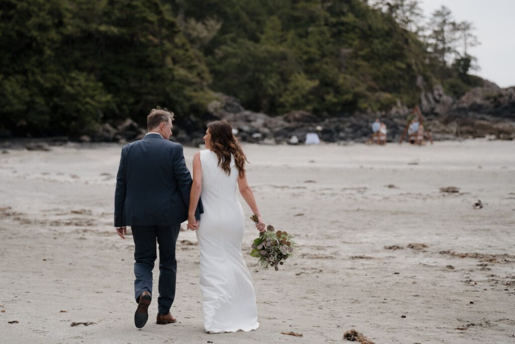 Bride and Groom first look before Wedding Ceremony at Crystal Cove Beach Resort at Chesterman Beach. Local Tofino BC Wedding Photographer captures moments on both photo and video