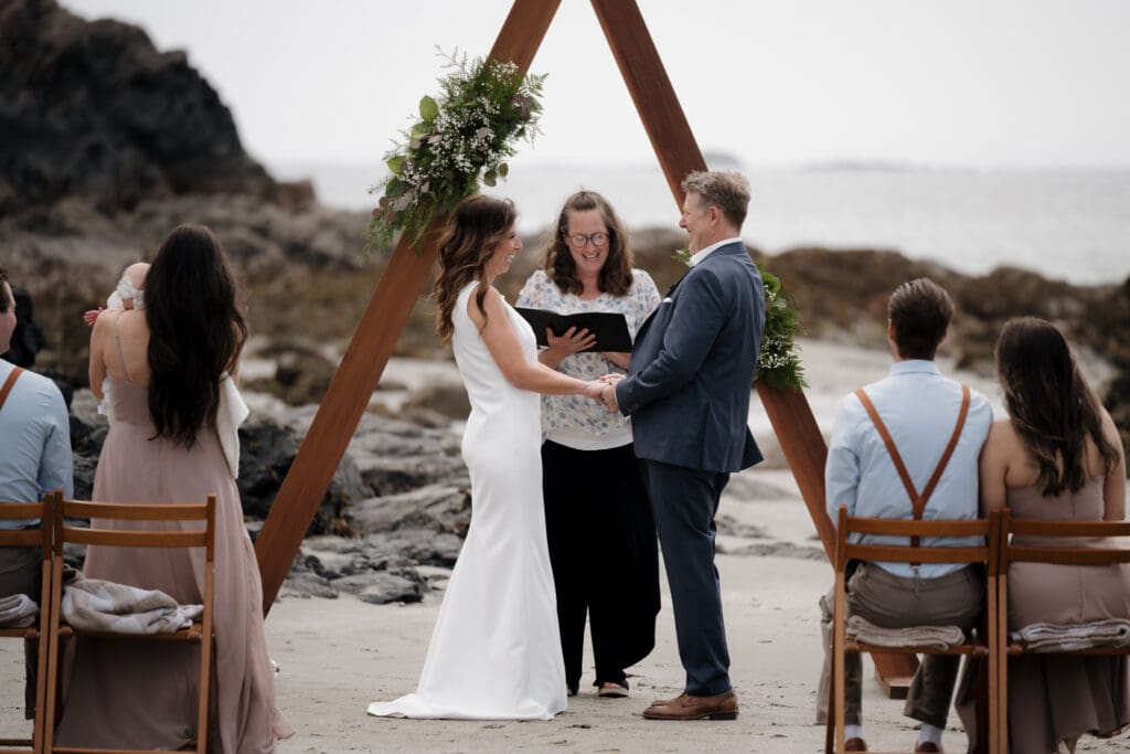 Bride and Groom first look before Wedding Ceremony at Crystal Cove Beach Resort at Chesterman Beach. Local Tofino BC Wedding Photographer captures moments on both photo and video