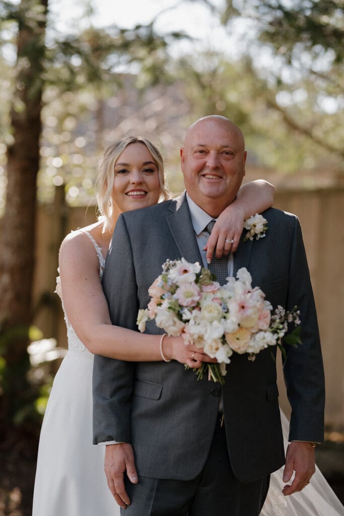 Hayley Zumkeller Victoria BC Wedding Photographer captures image of a bride with her Dad at a Gowlland Harbour Intimate Wedding.