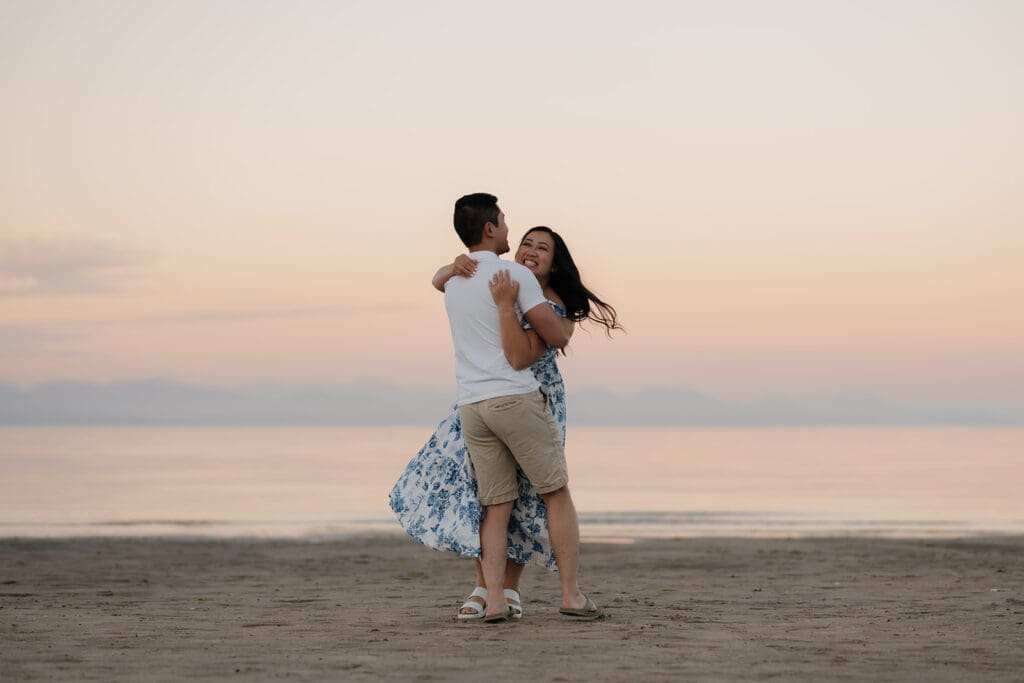 what to wear to your engagement photoshoot in the summer in Victoria BC, photo of couple in nice outfit at sunset at the beach