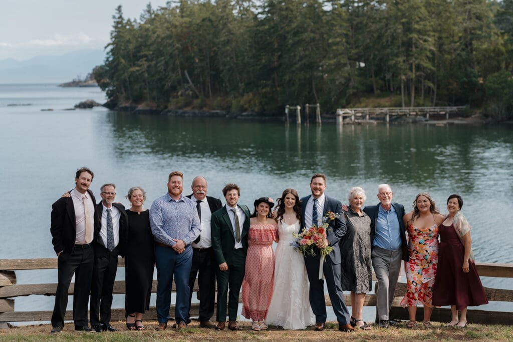 Hayley Zumkeller Victoria BC Wedding Photographer and Filmmaker captures a large extended family portrait oceanfront at Pearson College.