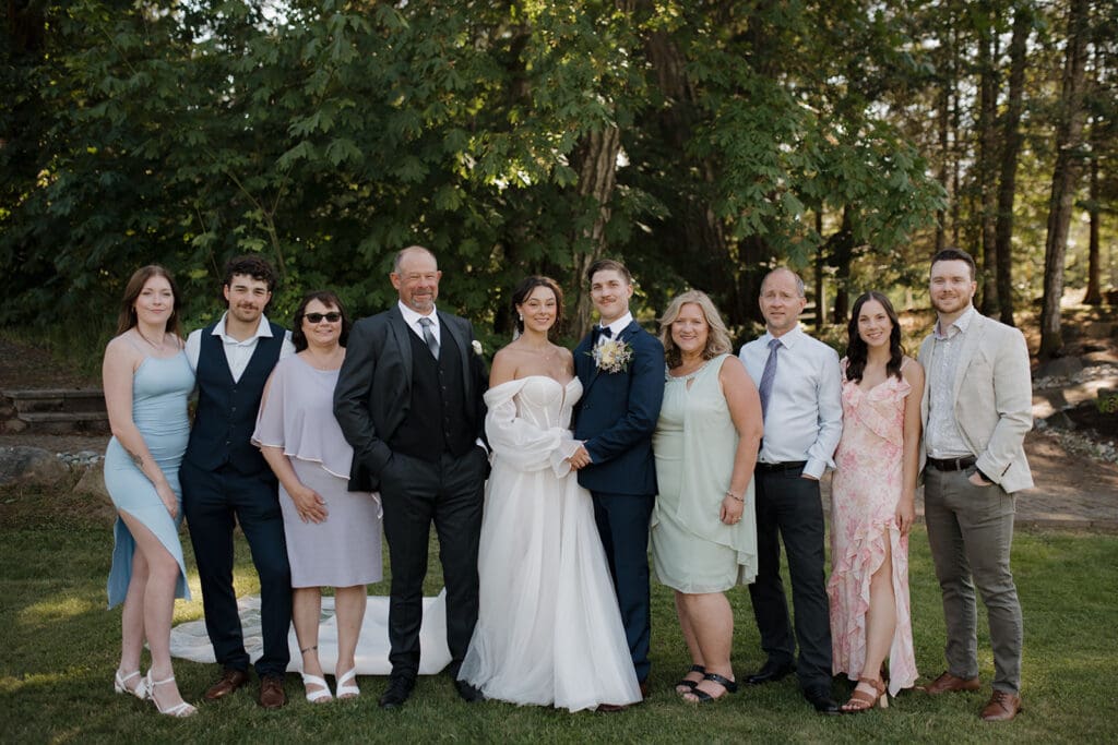 Hayley Zumkeller Victoria BC Wedding Photographer captures image of a bride and groom with their extended family.
