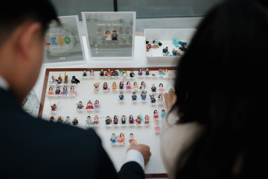 Hayley Zumkeller, Victoria BC Wedding Videographer and Photographer and team capture the very unique Lego Built guest book during a mini-destination wedding at Inn at Laurel Point on Vancouver Island.