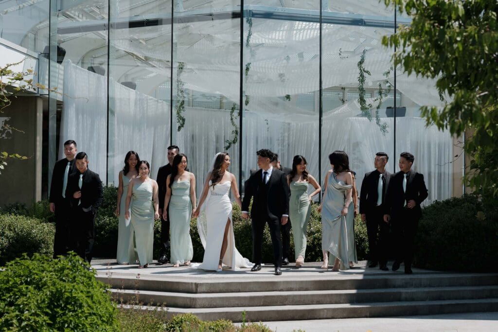 Hayley Zumkeller, Victoria BC Wedding Videographer and Photographer captures the full wedding party during this fun, elegant mini-destination wedding at Laurel Point Inn on Vancouver Island.
