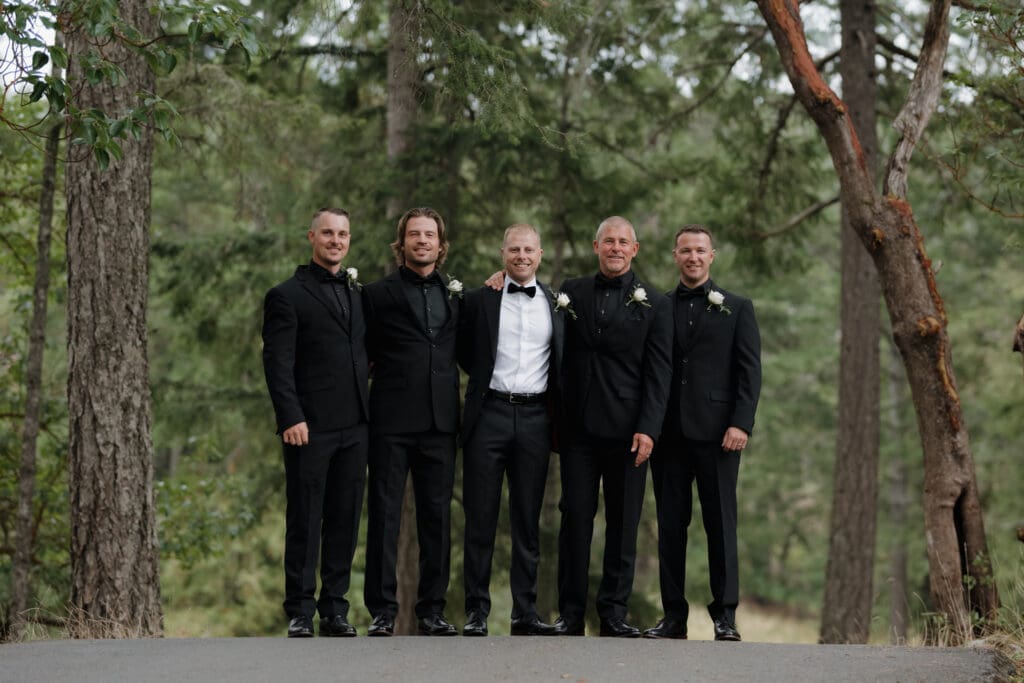 Hayley Zumkeller Photography and Videography team capture a groom and his groomsman with a forest backdrop on Vancouver Island BC.