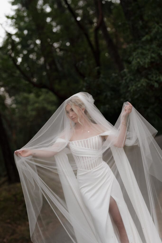 Hayley Zumkeller photography & videography team from Victoria BC capture a bride in her long veil — ethereal, elegant, and absolutely Vogue-worthy.