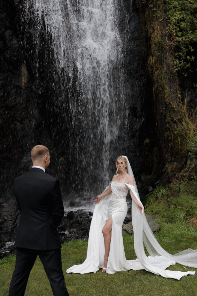Hayley Zumkeller photography and videography team capture a bride and groom at the waterfall at Olympic View golf course on Vancouver Island.