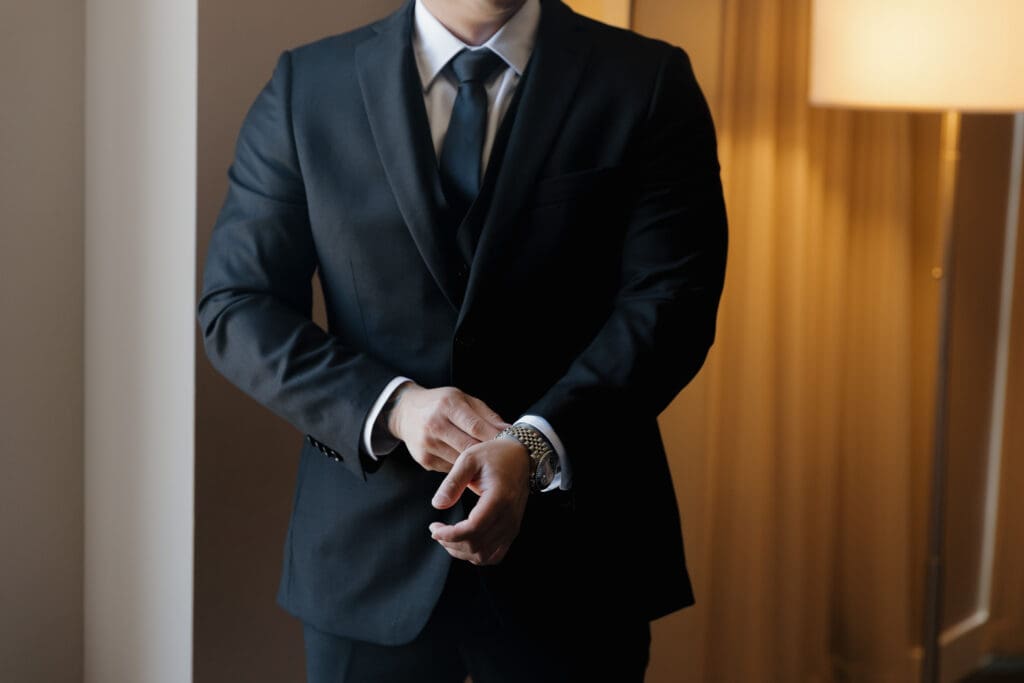 A handsome groom in his tuxedo getting ready for his wedding day in Victoria BC. Image captured by Hayley Zumkeller photography and videography.