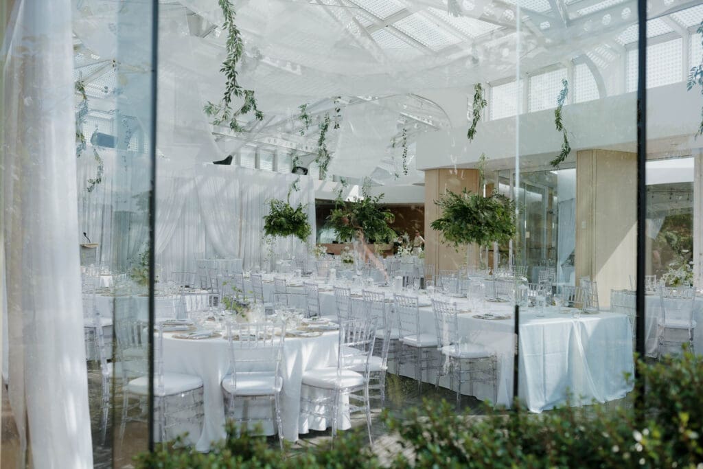 Hayley Zumkeller Photography and Videography team capture the beautiful reception floral and table arrangements at Laurel Point Inn on Vancouver Island.