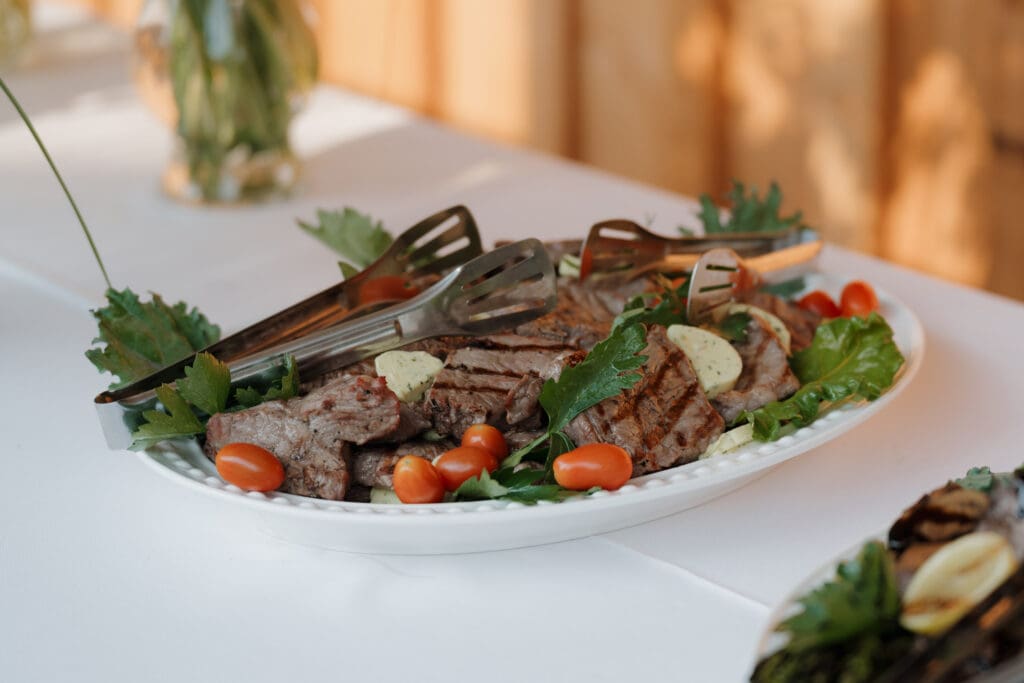 Hayley Zumkeller photography and videography team from Victoria BC capture a plated dinner to highlight the caterer at this Comox Valley wedding on Vancouver Island.