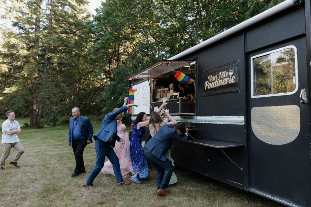 Food trucks are one of the latest wedding trends of 2026/2027! This poutine food truck was at an outdoor wedding on Vancouver Island. A great option for destination wedding guests to enjoy a famous Canadian treat.