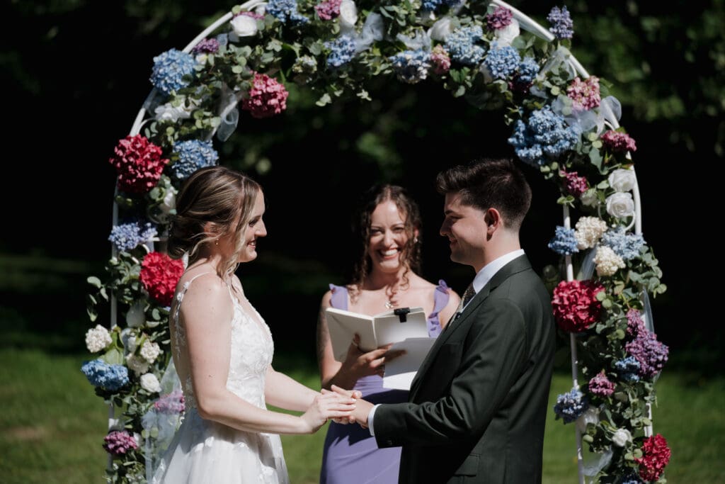 The smiling celebrant at an outdoor wedding on Vancouver Island.