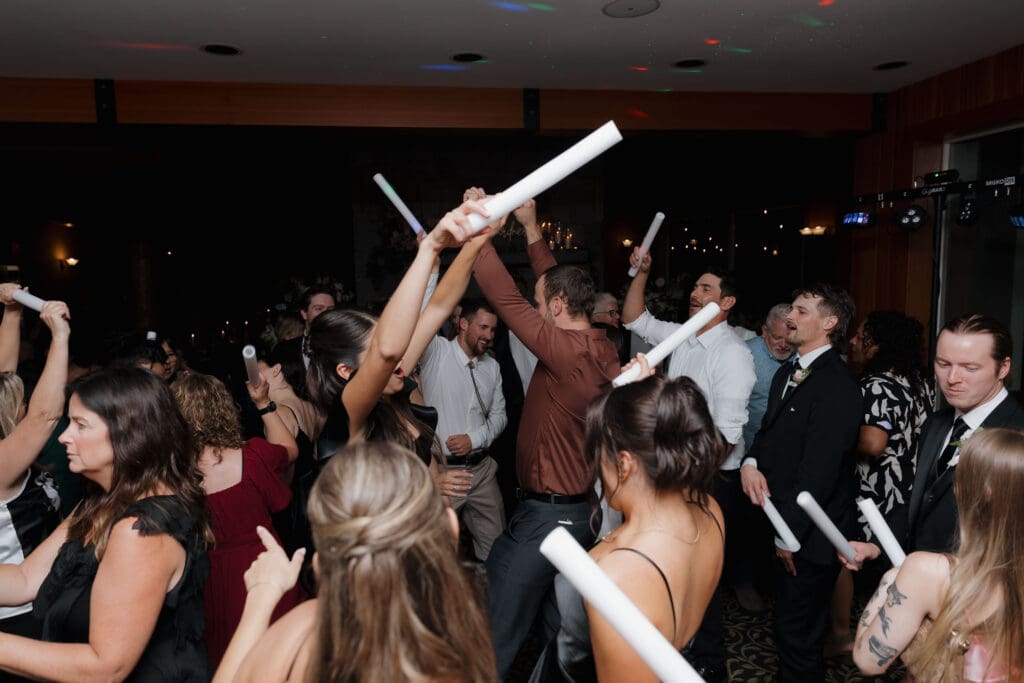 Everyone having fun on the dance floor during a Vancouver Island wedding reception held at Gowlland Harbour Resort.