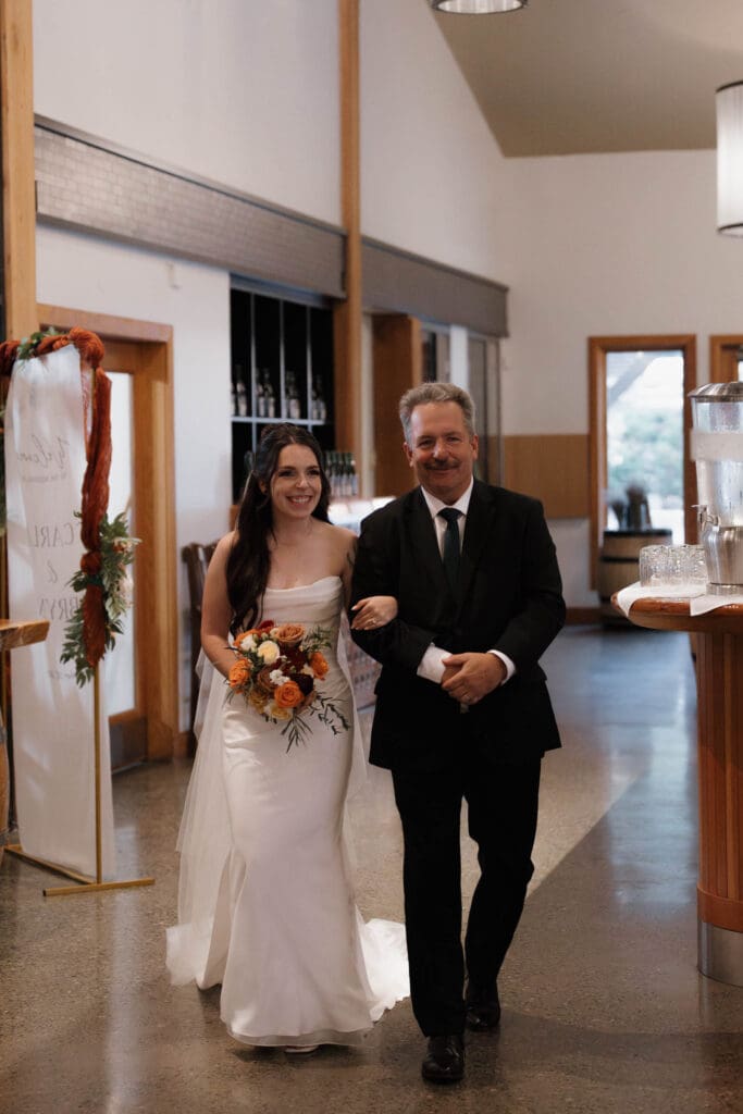 Father of the bride emotional during wedding ceremony at Church and State Winery captured by Victoria BC wedding videographer Hayley Zumkeller