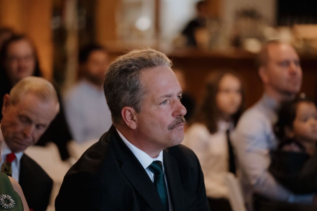Hayley Zumkeller photography and videography team from Victoria BC capture a proud father of the bride during the emotional ceremony at Church and State Winery on Vancouver Island.