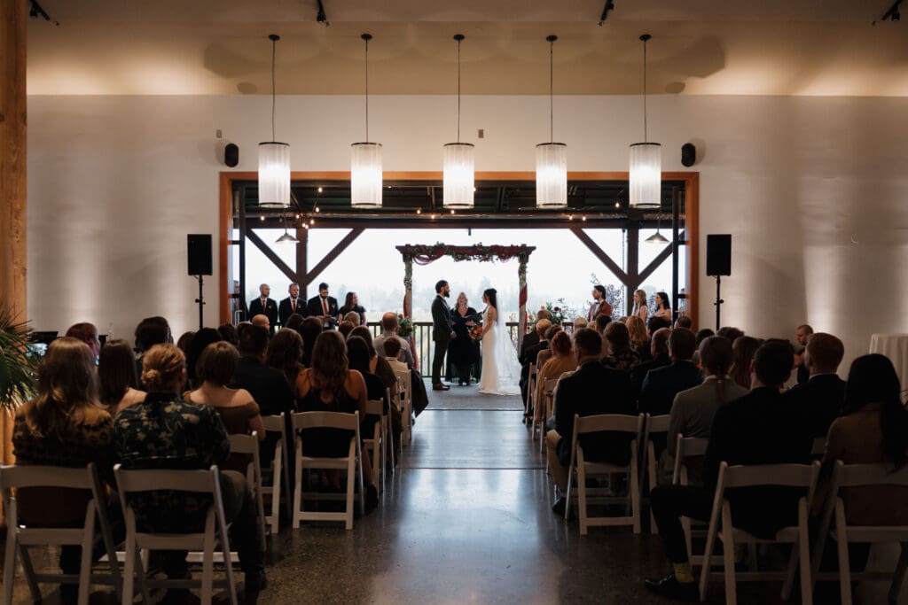 Hayley Zumkeller photography and videography team from Victoria BC capture the wedding ceremony during a Fall wedding a Church and State Winery on Vancouver Island.