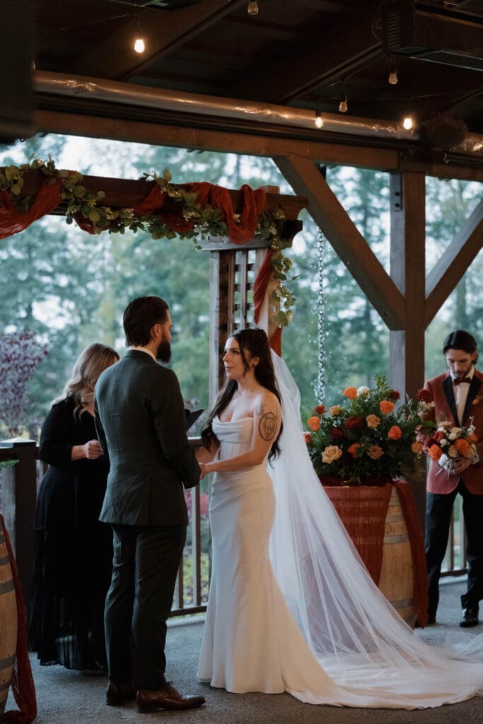 Hayley Zumkeller photography and videography team from Victoria BC capture the wedding ceremony during a Fall wedding a Church and State Winery on Vancouver Island.