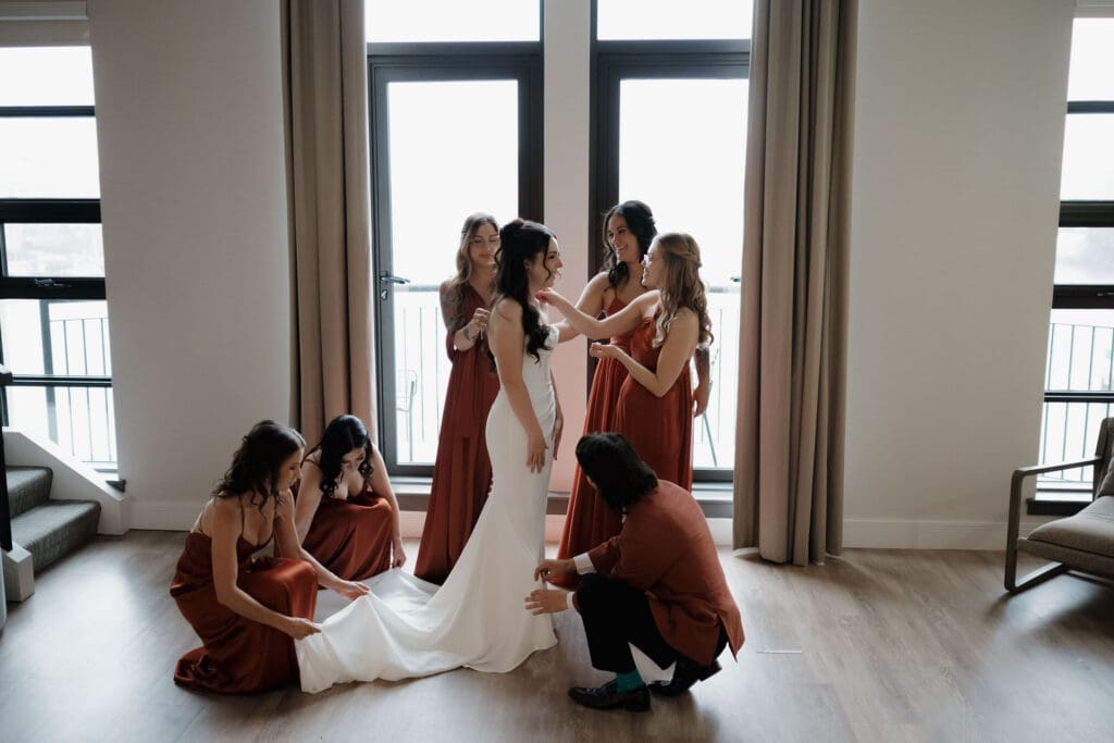 Hayley Zumkeller photography and videography team from Victoria BC capture the bride with her bridesmaids as they get ready at Delta Ocean Pointe on Vancouver Island.