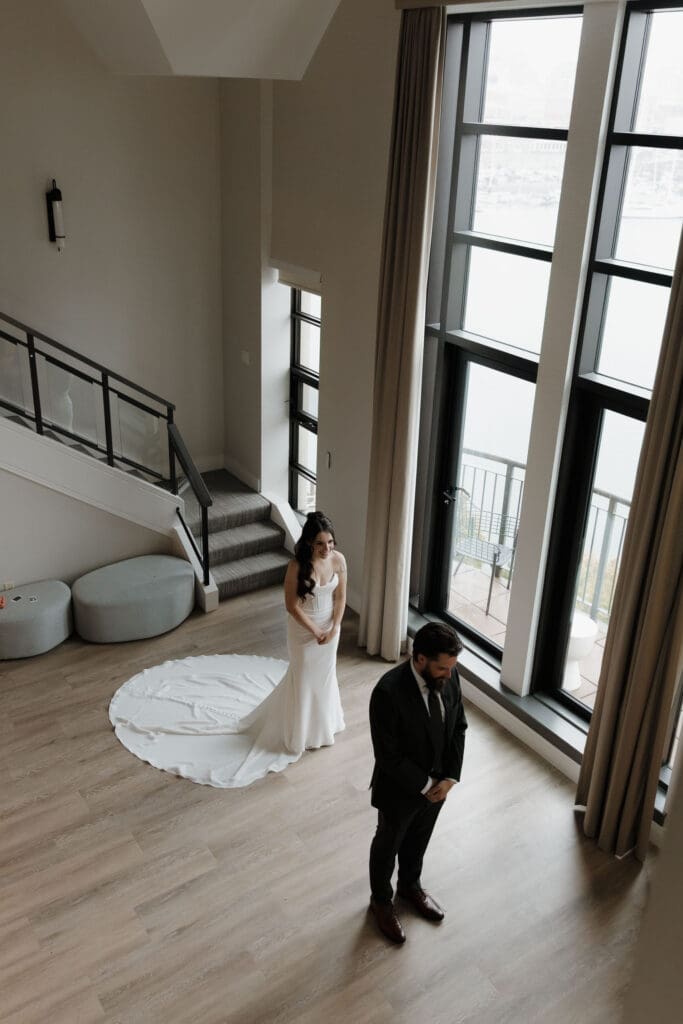Hayley Zumkeller photography and videography team from Victoria BC captures a bride and groom in the last moments before their emotional first look at Delta Ocean Pointe on Vancouver Island.