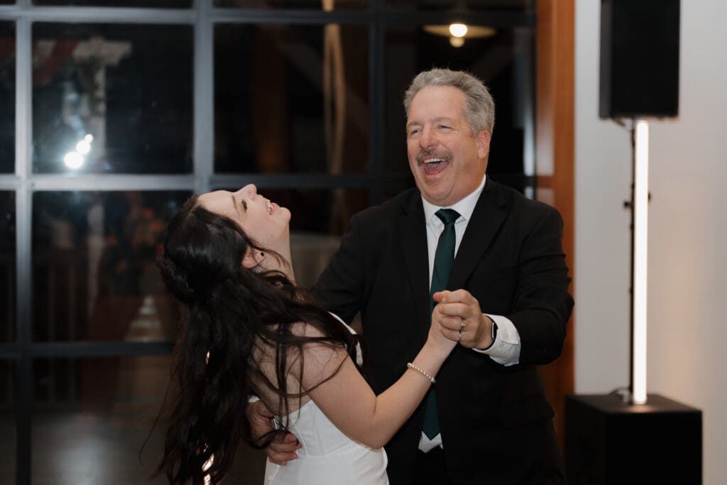 Wedding reception dance floor at Church and State Winery Victoria BC captured by wedding videography team Hayley Zumkeller