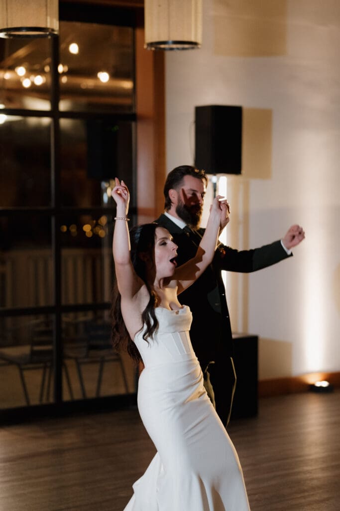 Hayley Zumkeller photography and videography team from Victoria BC captures a newly married bride and groom entering their reception in a fun filled celebration style. Image captured at Church and State Winery on Vancouver Island.