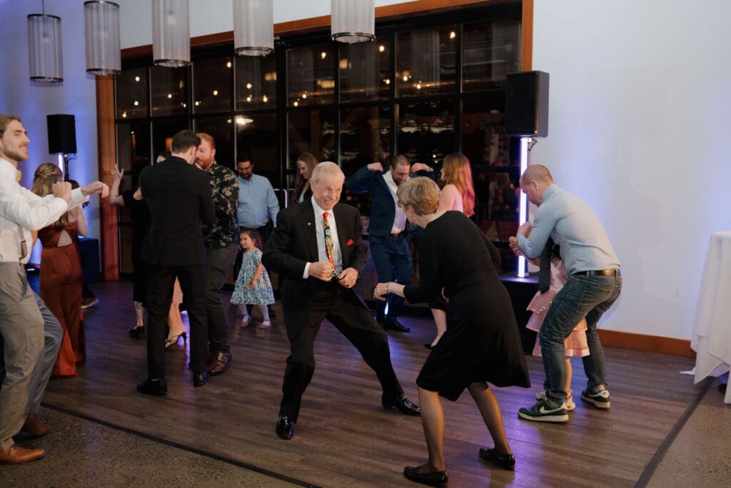 Everyone enjoying the dance floor during a wedding reception held at Church and State Winery on Vancouver Island.