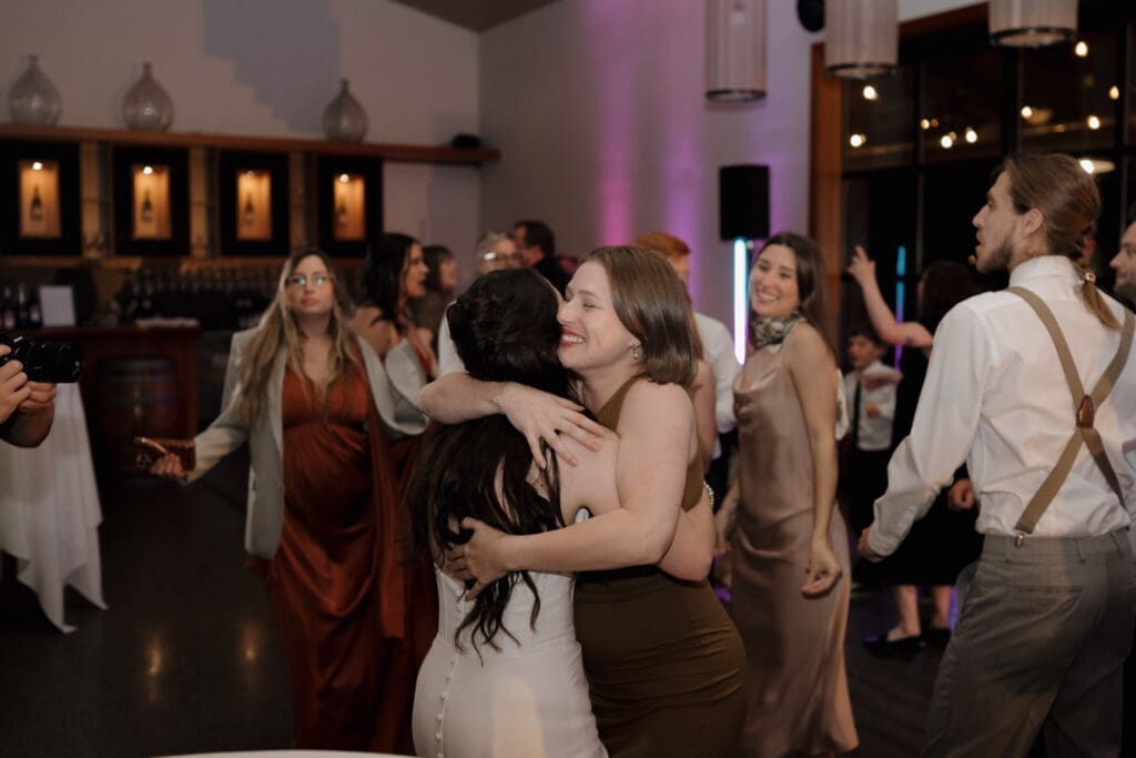 Wedding reception dance floor at Church and State Winery Victoria BC captured by wedding videography team Hayley Zumkeller
