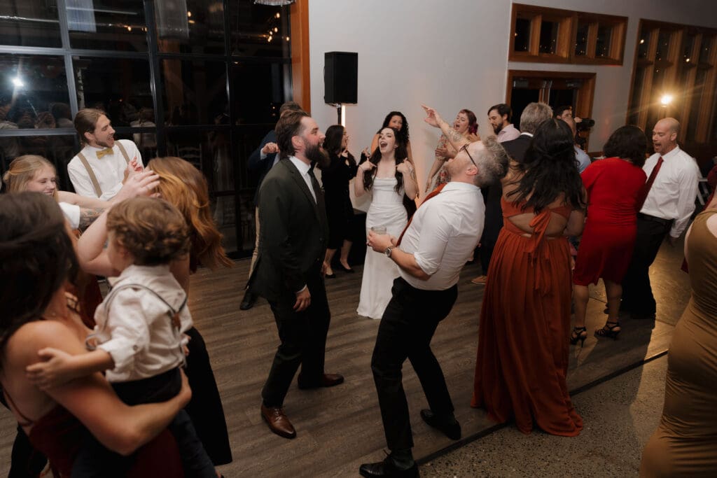 Wedding reception dance floor at Church and State Winery Victoria BC captured by wedding videography team Hayley Zumkeller