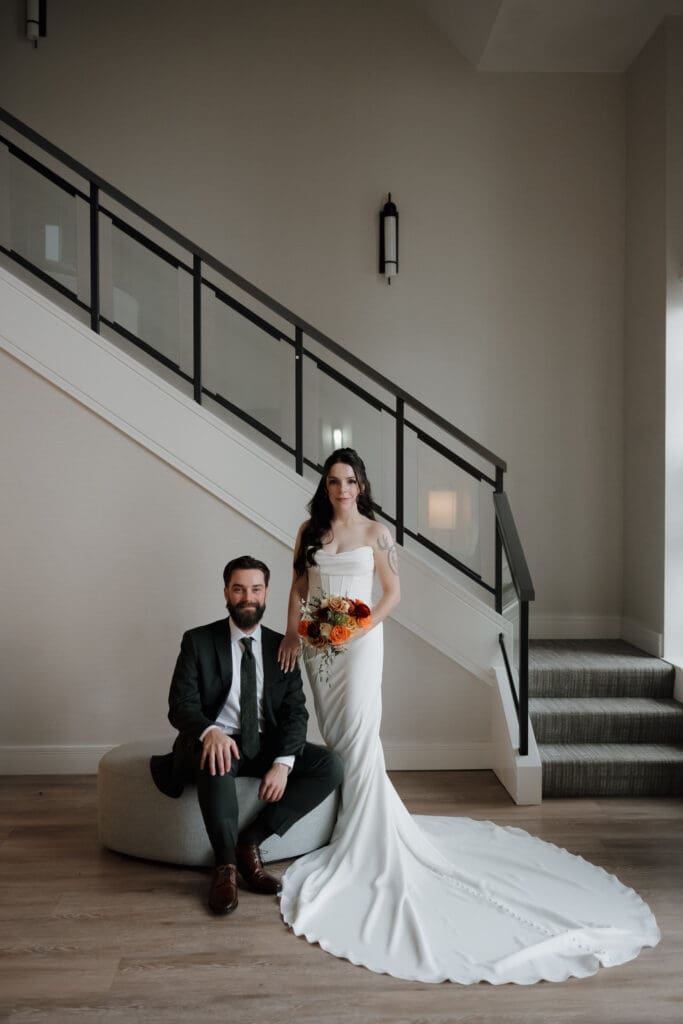 Bride and groom first look in hotel suite at Delta Ocean Pointe overlooking the ocean in Victoria BC