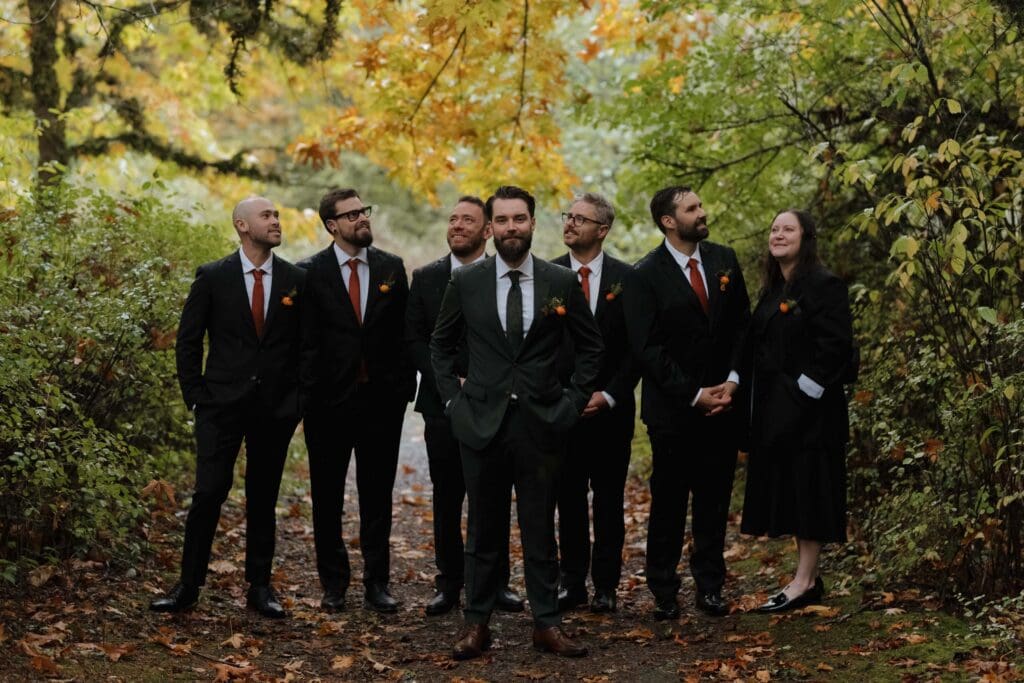 Couple sharing private vows in Vancouver Island forest in the rain surrounded by fall colours