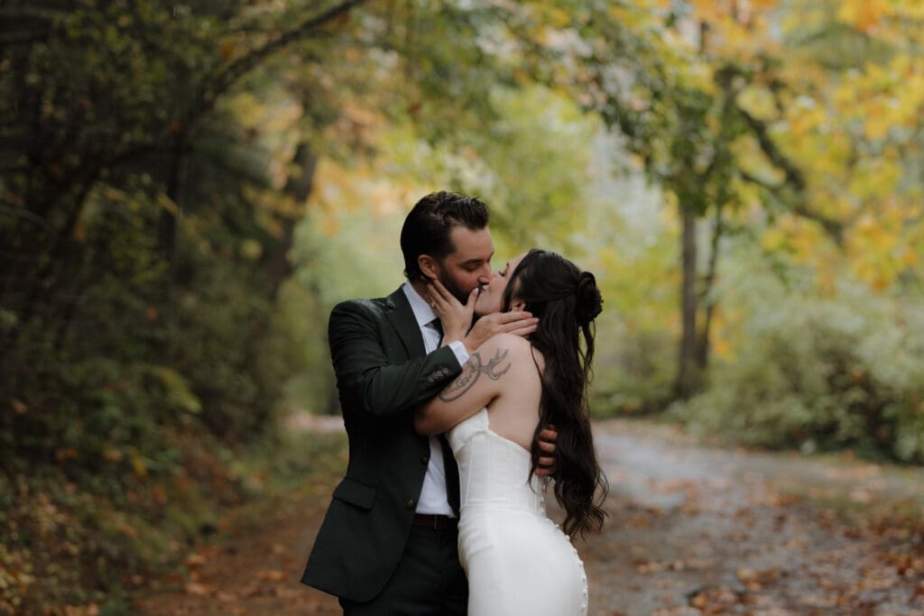 Couple sharing private vows in Vancouver Island forest in the rain surrounded by fall colours