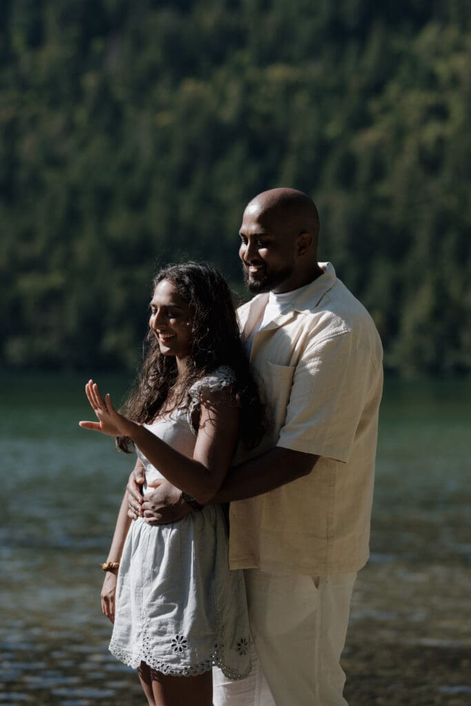 Romantic newly engaged couple photos Vancouver Island proposal session. They look in awe at the ring, soaking in the moment that was expertly captured by Hayley Zumkeller Photography and Videography team from Victoria BC.