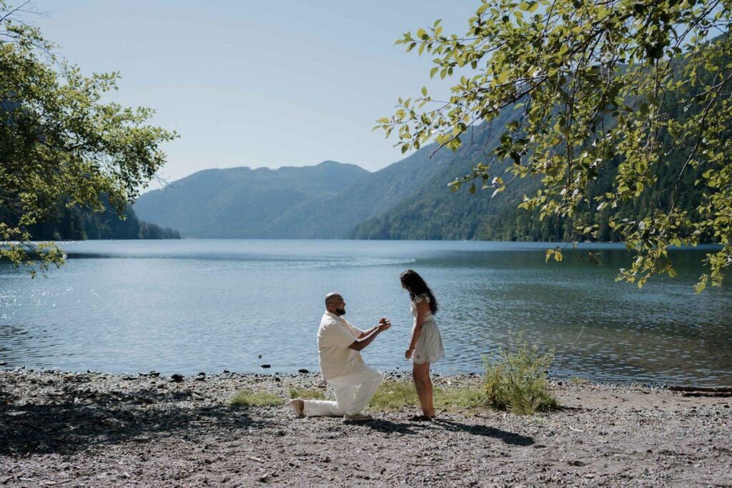 Quiet beach proposal location on Vancouver Island near Lake Cameron. Forested hills and mountains surrounding the water were perfectly captured by Hayley Zumkeller photography from Victoria BC.