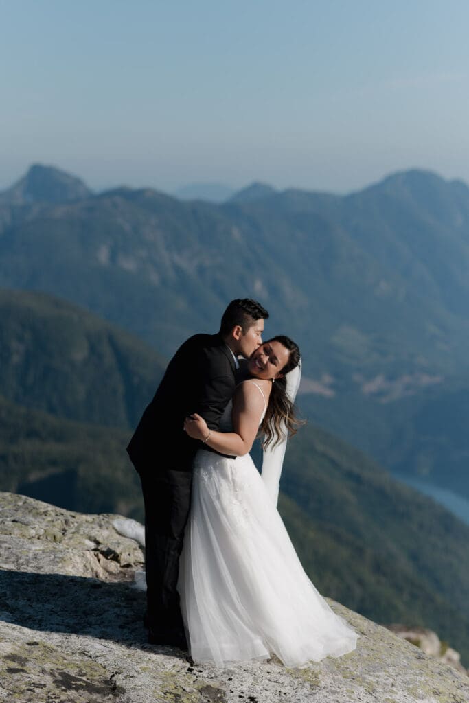 Vancouver Island helicopter elopement photographer capturing mountain top wedding experience in British Columbia.