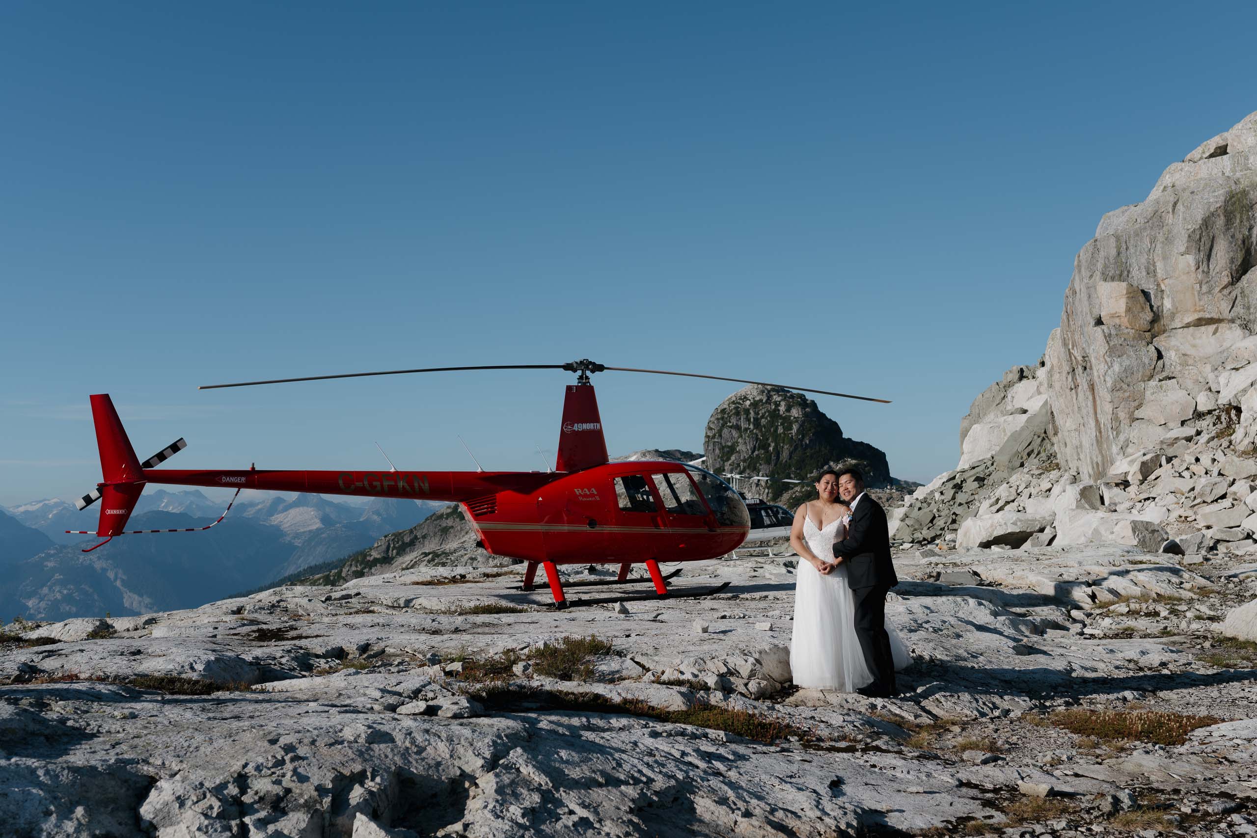 Vancouver Island helicopter elopement photographer capturing mountain top wedding experience in British Columbia