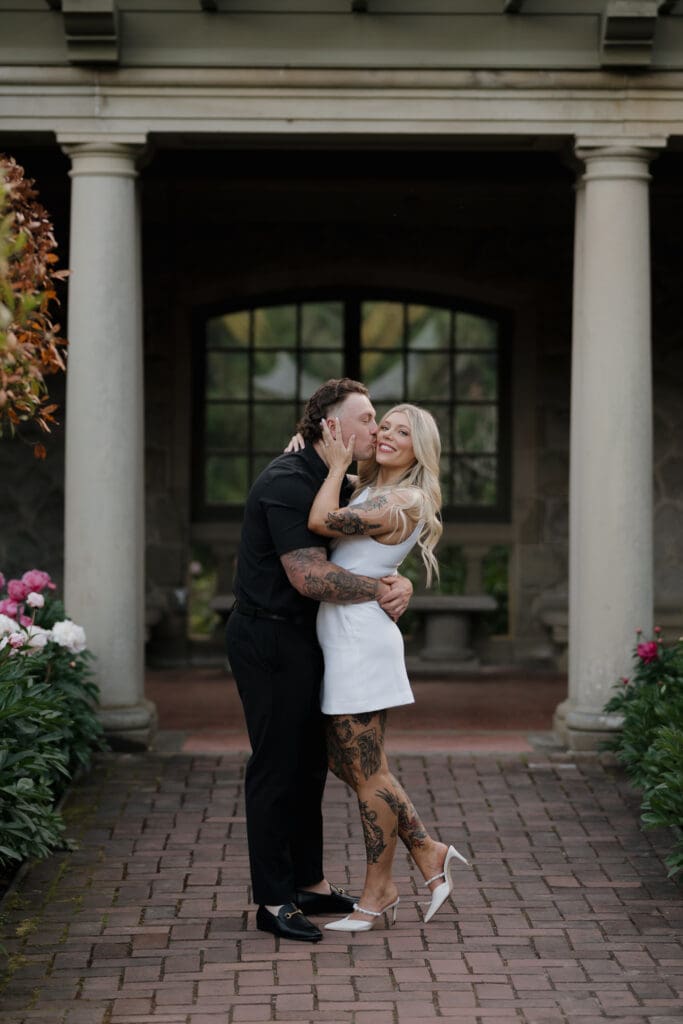 Engagement Photoshoot of couple kissing at hatley castle, showing what to wear to your engagement photoshoot in Victoria