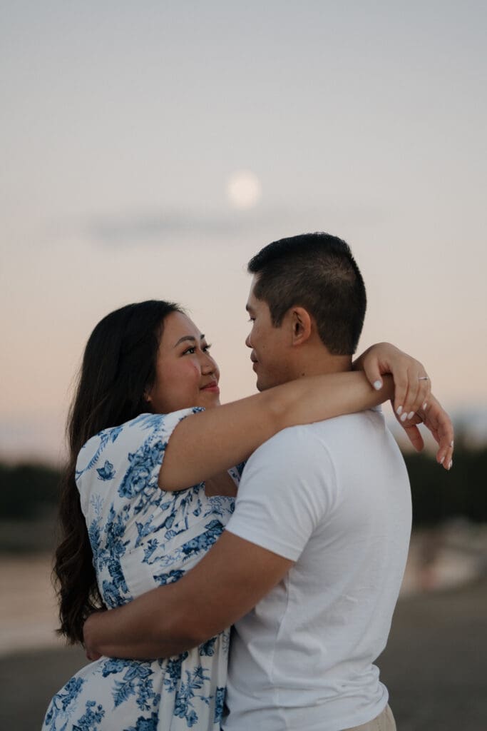 Romantic close-up of couple laughing during Saratoga Beach engagement photos at sunset on Vancouver Island.