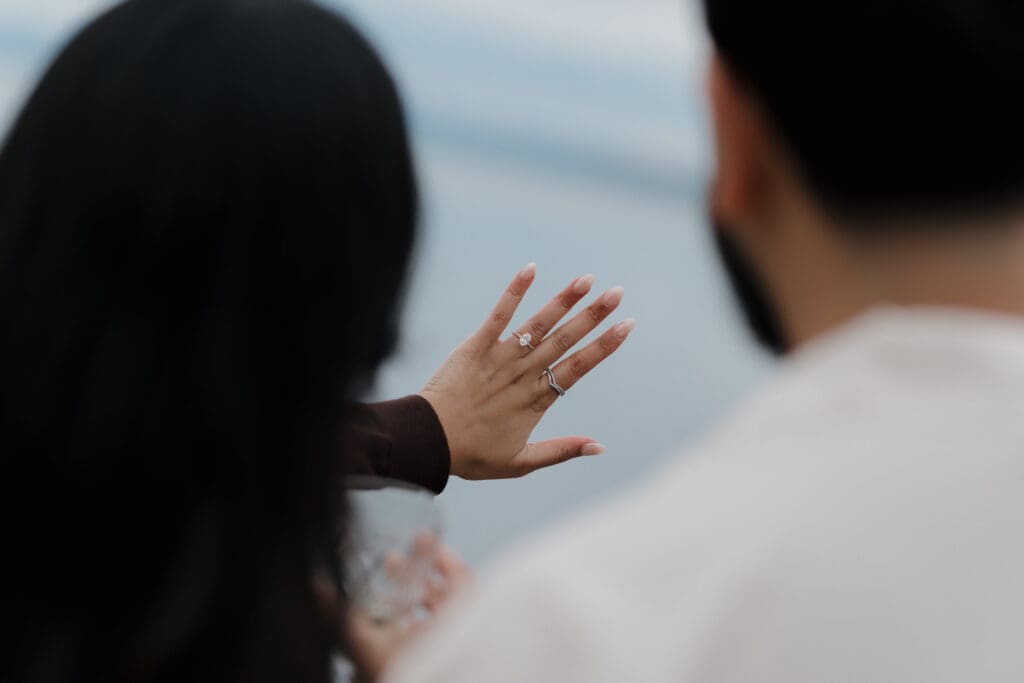 Engagement ring close-up during surprise proposal at Saxe Point Park, Victoria BC