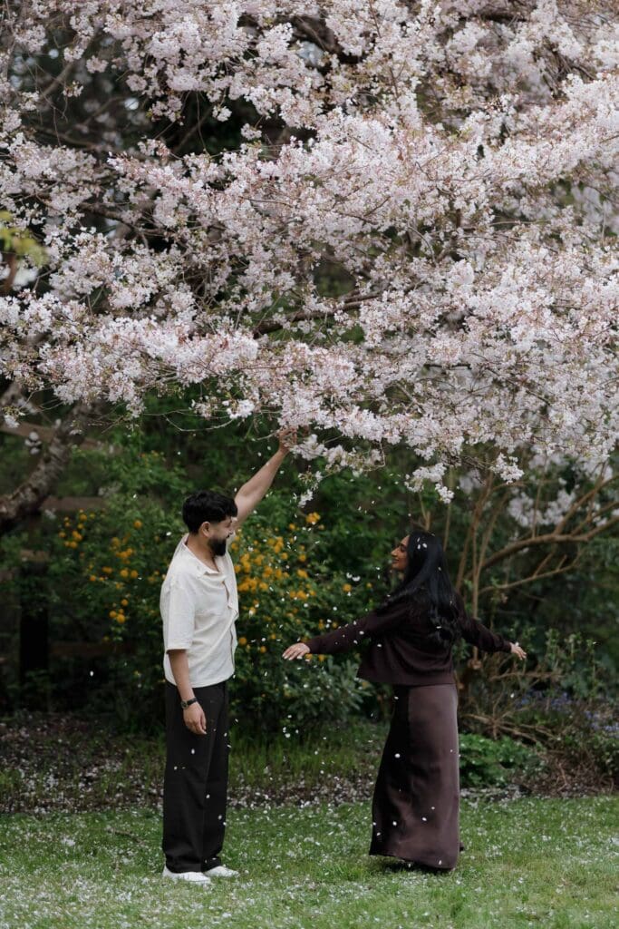 Candid emotional moment between Harwinder and Imran during surprise proposal shoot at Saxe Point Park, Victoria BC