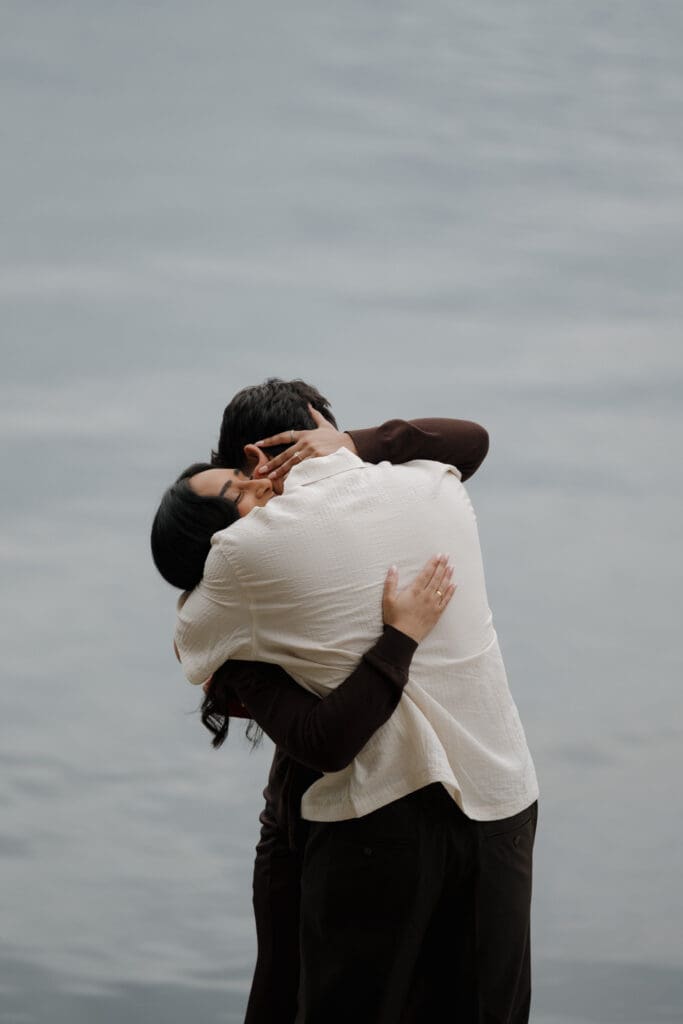 Imran's reaction during surprise proposal at Saxe Point Park, Victoria BC — proposal photography by Hayley Zumkeller